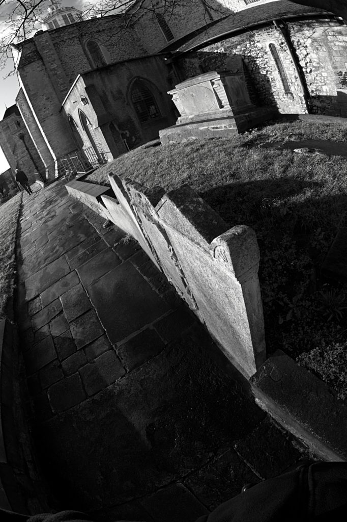 B84V1827t1-elderley-man-past-gravestones